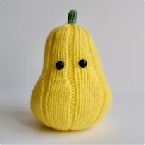 photo d'une peluche courge au tricot avec deux yeux noirs tout ronds