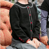 photo d'un pullover pour enfant à motifs ressemblant un cardigant
