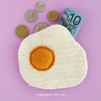 photo d'un porte-monnaie en forme d'oeuf au plat