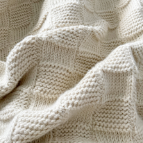 photo d'une couverture texturée au crochet