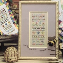 broderie de coccinelles, fleurs, papillons et libelulles